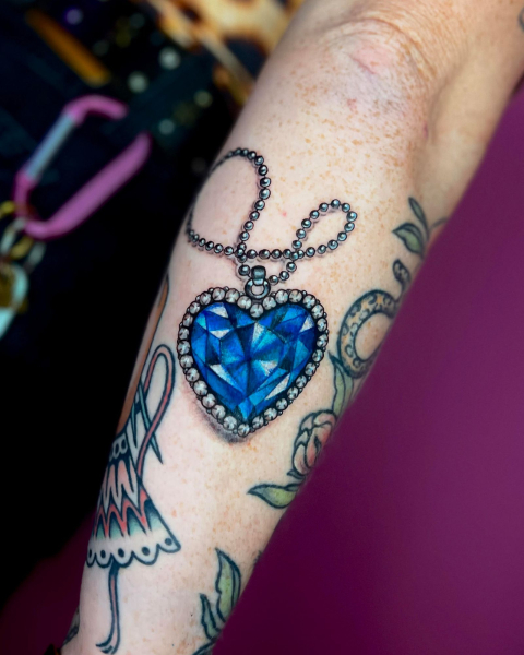 2026 tattoo trends nostalgic themes titanic heart of the ocean necklace tattoo